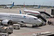 In this April 28, 2017, file photo, Garuda Indonesia planes are parked on the apron at the Soekarno-Hatta International Airport in Tangerang, Indonesia. Indonesia's flag carrier is seeking the can ...