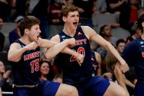 Liberty's Zach Farquhar, left, and Keegan McDowell celebrate during the second half of a first round men's college basketball game against Mississippi State in the NCAA tournament Friday, March 22 ...