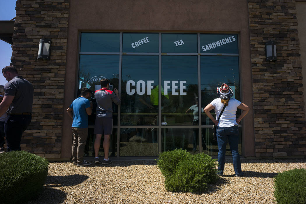 An overflow crowd listens to Democratic presidential candidate and former Texas congressman Beto O'Rourke, not pictured, speak during a campaign stop at Pour Coffeehouse in Las Vegas on Sunday, Ma ...