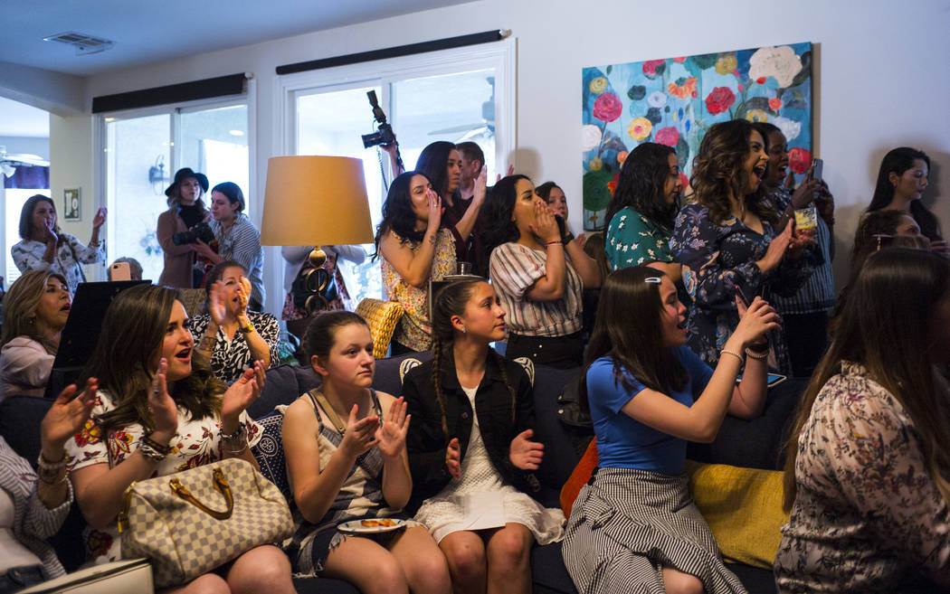 Members of the Mujeres Network cheer as Democratic presidential candidate and former Texas congressman Beto O'Rourke, not pictured, speaks during a meet and greet event with the Mujeres Network in ...