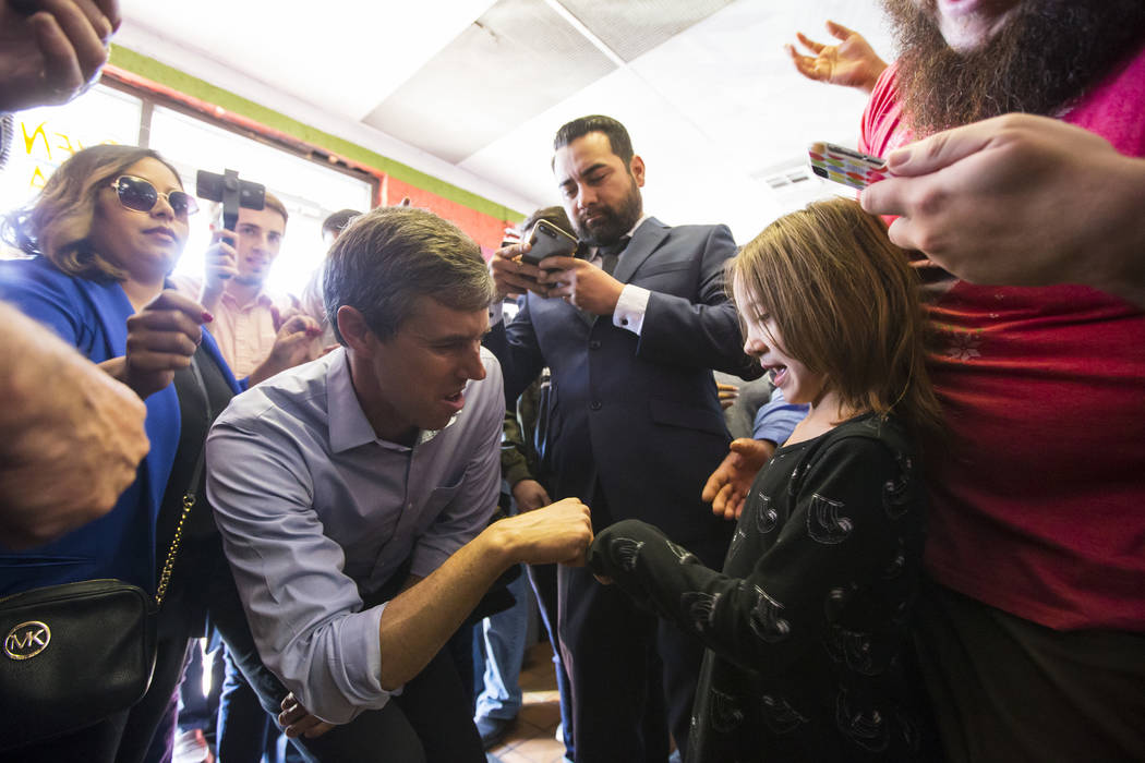 Democratic presidential candidate and former Texas congressman Beto O'Rourke greets a supporter during a campaign stop at Arandas Taqueria in Las Vegas on Sunday, March 24, 2019. (Chase Stevens/La ...