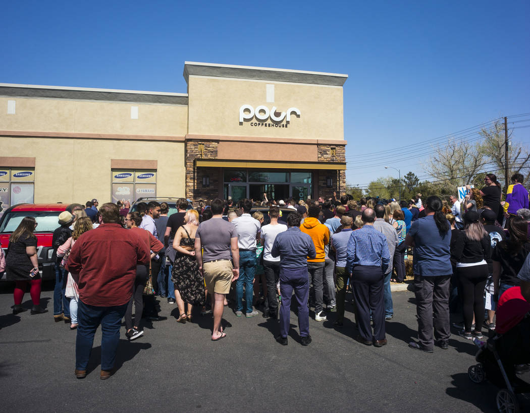 An overflow crowd listens to Democratic presidential candidate and former Texas congressman Beto O'Rourke, not pictured, speak during a campaign stop at Pour Coffeehouse in Las Vegas on Sunday, Ma ...