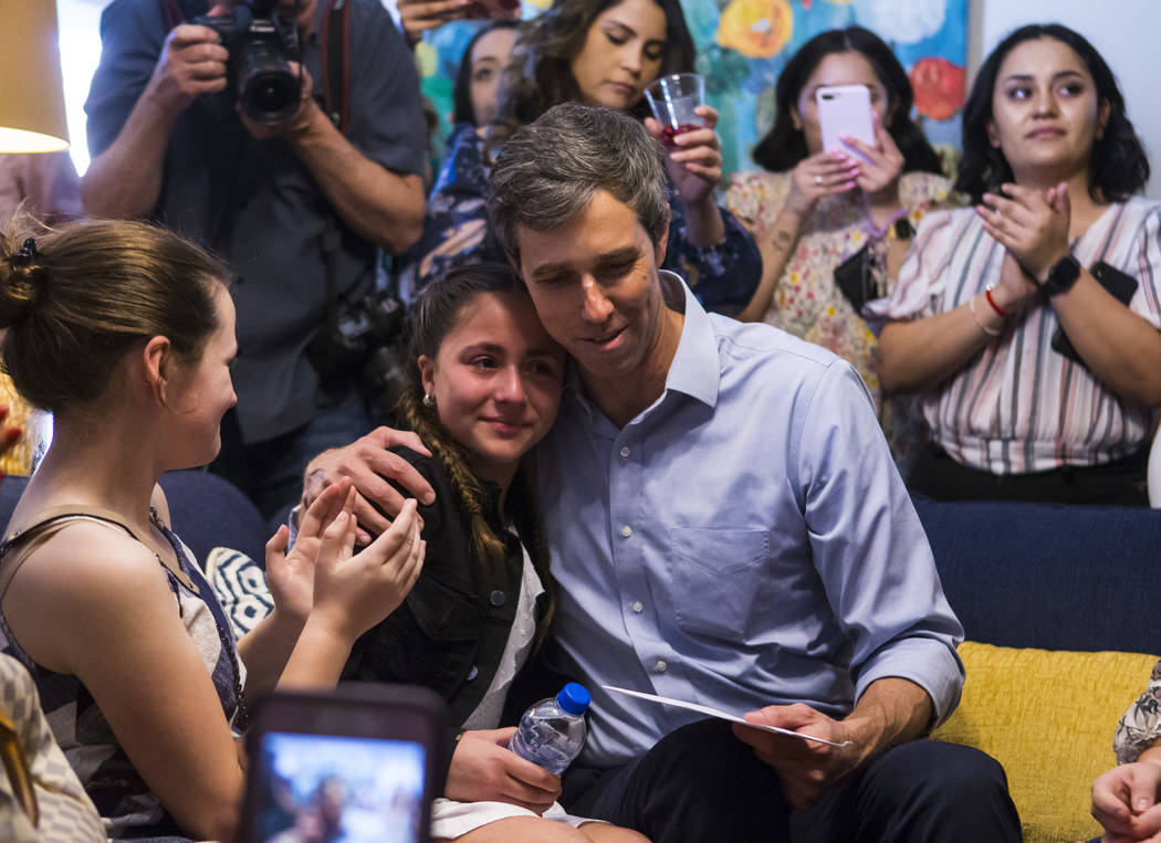 Eleven-year-old Karola Garcia is comforted by Democratic presidential candidate and former Texas congressman Beto O'Rourke at a meet and greet event with the Mujeres Network in west Las Vegas on S ...