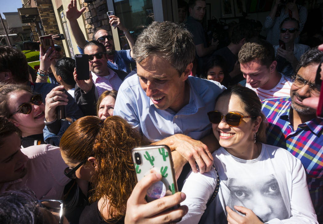 Democratic presidential candidate and former Texas congressman Beto O'Rourke takes pictures with supporters during a campaign stop at Pour Coffeehouse in Las Vegas on Sunday, March 24, 2019. (Chas ...