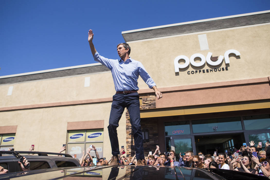 Democratic presidential candidate and former Texas congressman Beto O'Rourke acknowledges the crowd after arriving at a campaign stop at Pour Coffeehouse in Las Vegas on Sunday, March 24, 2019. (C ...