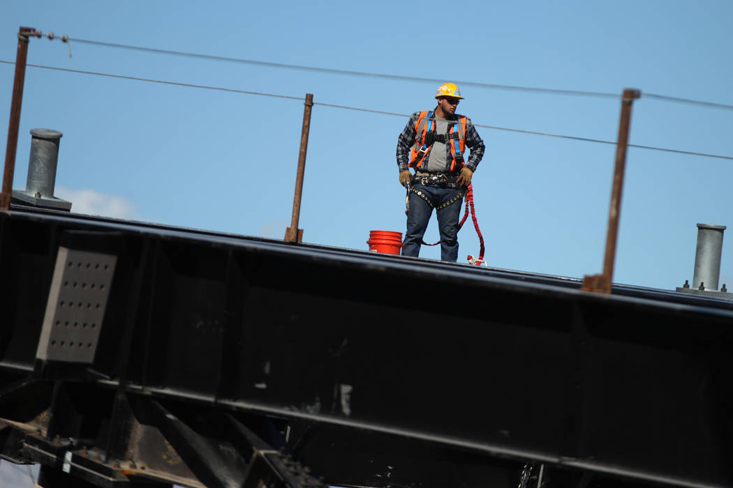A worker stands on a roof truss that is scheduled to go up in weeks at the Raiders stadium construction site in Las Vegas, Friday, March 22, 2019. Erik Verduzco Las Vegas Review-Journal @Erik_Verduzco