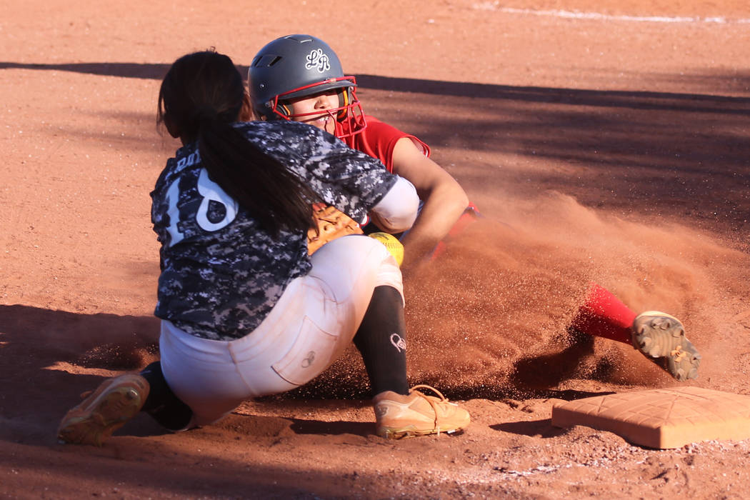 Liberty's Jessica Meza (20) slides safe for a triple against Desert Oasis' Jaid Riana Raval (18 ...