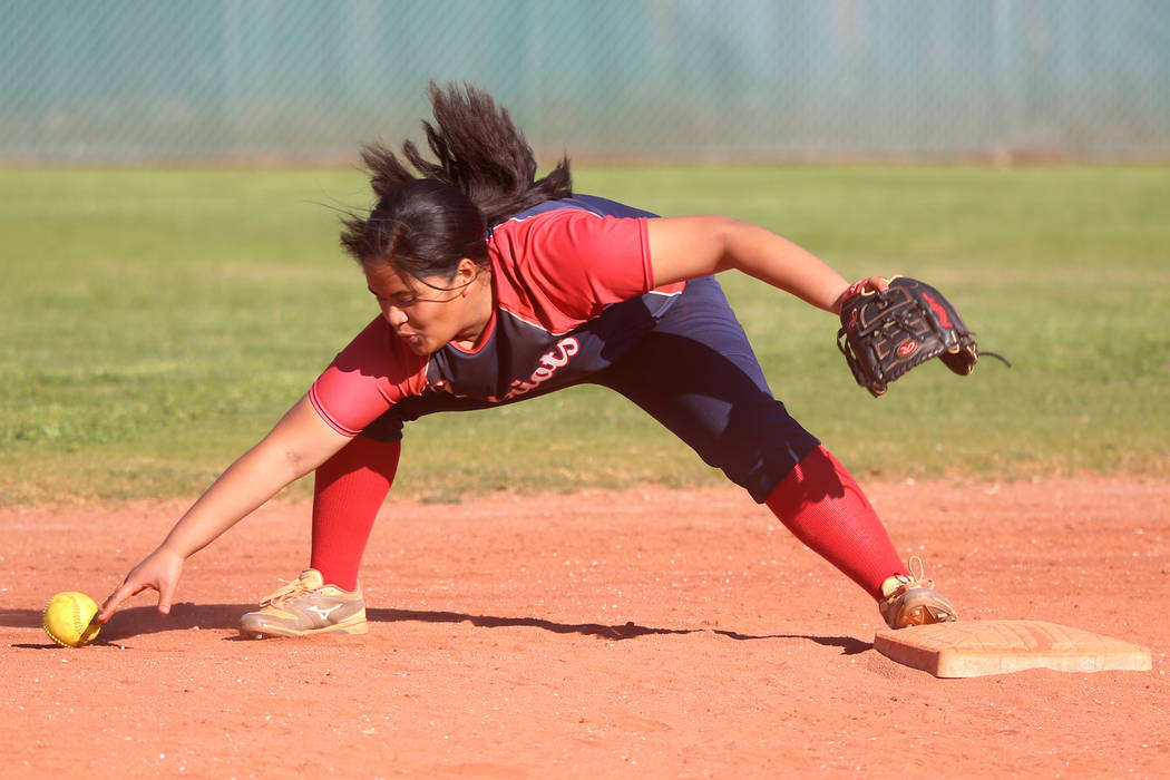 Liberty's Debra Tofi (44) fails to make a play to allow a base hit against Desert Oasis in the ...