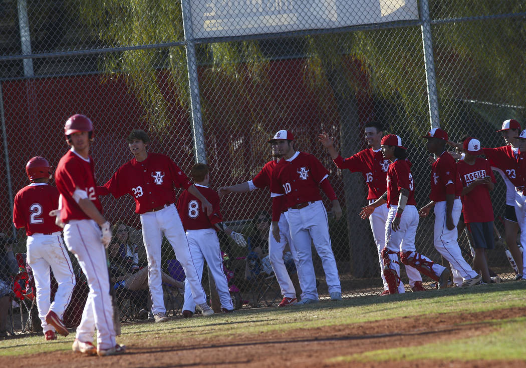 Arbor View players celebrate a pair of runs against Las Vegas during a baseball game at Arbor V ...