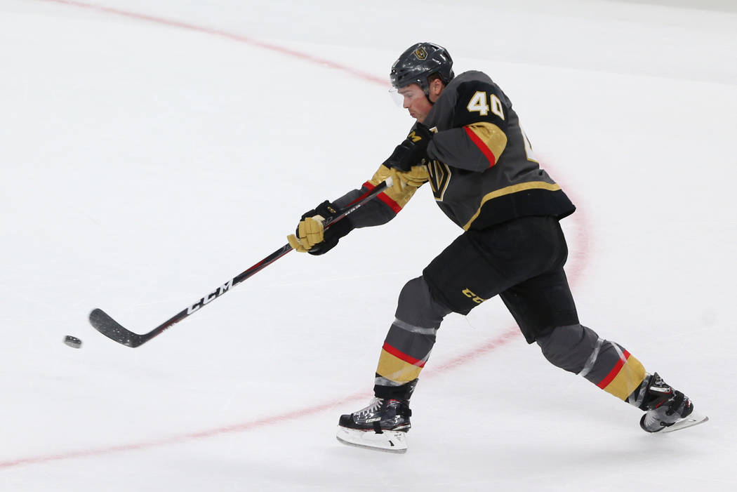 Vegas Golden Knights center Ryan Carpenter (40) takes a shot for a miss against the Detroit Red Wings during the third period of an NHL hockey game at T-Mobile Arena in Las Vegas, Saturday, March ...