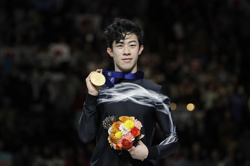 Nathan Chen from the U.S. stands on the podium with the gold medal for the men's free skating routine during the ISU World Figure Skating Championships at Saitama Super Arena in Saitama, north of ...