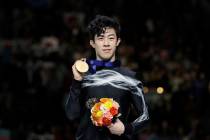 Nathan Chen from the U.S. stands on the podium with the gold medal for the men's free skating routine during the ISU World Figure Skating Championships at Saitama Super Arena in Saitama, north of ...