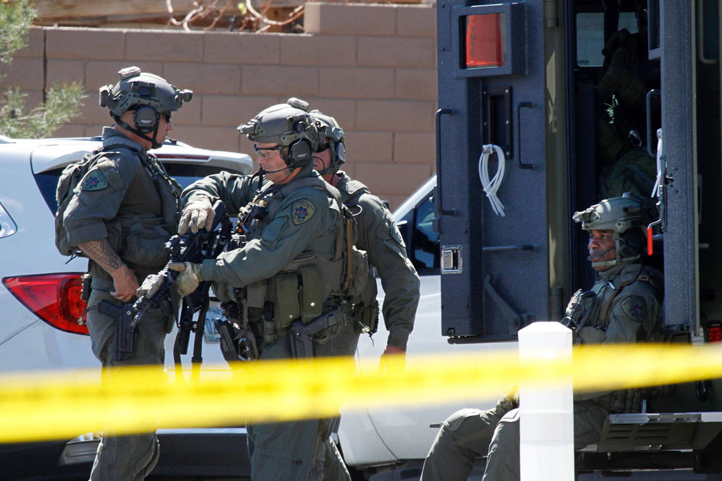 Metropolitan Police Department SWAT units are visible during a barricade situation near Grand Teton and Durango in the northwest area of the Las Vegas valley, Saturday, March 23, 2019. (Chitose Su ...