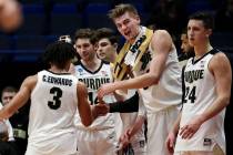 Purdue's Carsen Edwards (3) receives congratulations from Matt Haarms, second from right, and other teammates as he leaves late in the second half of a second-round men's college basketball game a ...