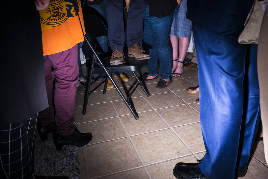 Democratic presidential candidate and former Texas congressman Beto O'Rourke stands on a stool while addressing a gathering during a campaign stop at a home in the Summerlin area of Las Vegas on S ...