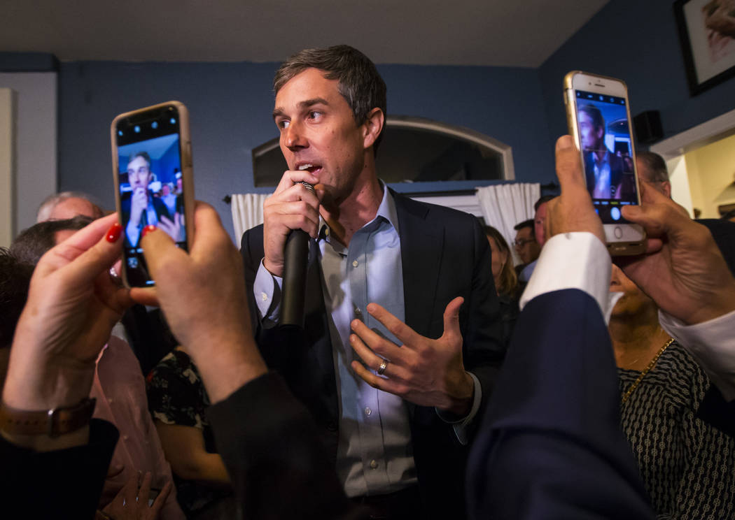 Democratic presidential candidate and former Texas congressman Beto O'Rourke addresses a gathering during a campaign stop at a home in the Summerlin area of Las Vegas on Saturday, March 23, 2019. ...