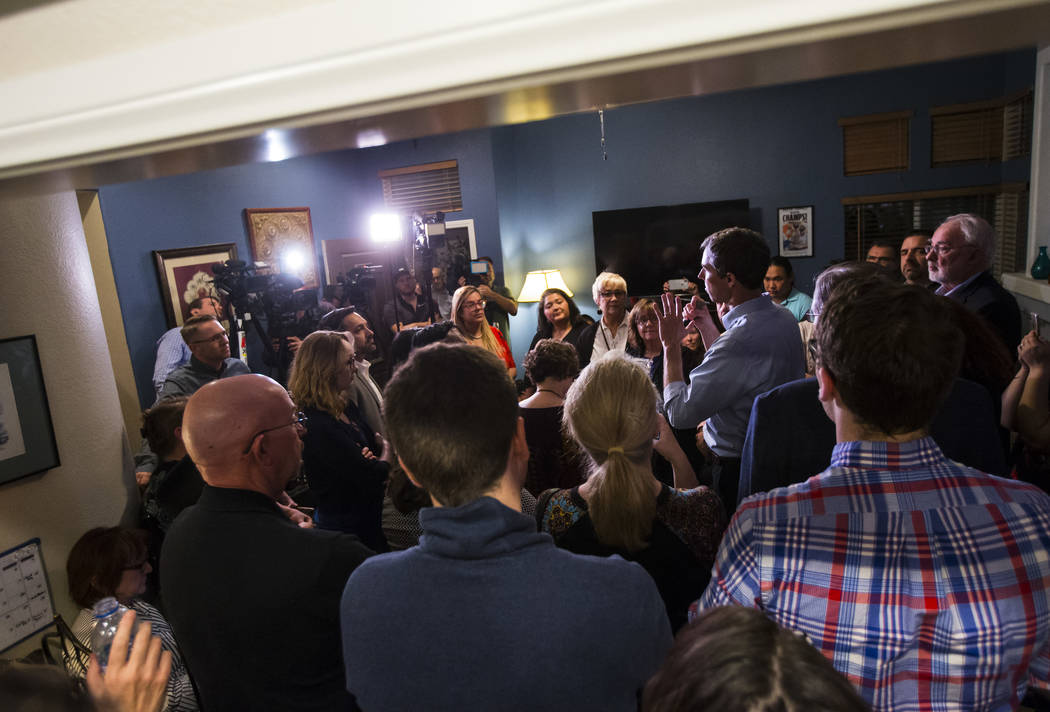 Democratic presidential candidate and former Texas congressman Beto O'Rourke, right, addresses a gathering during a campaign stop at a home in the Summerlin area of Las Vegas on Saturday, March 23 ...