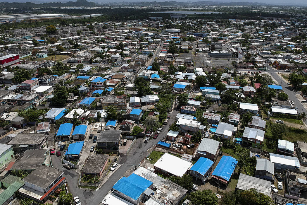 This June 18, 2018, file photo shows an aerial view of the Amelia neighborhood in the municipality of Catano, east of San Juan, Puerto Rico. A long-delayed disaster aid bill that’s a top politic ...