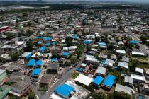 This June 18, 2018, file photo shows an aerial view of the Amelia neighborhood in the municipality of Catano, east of San Juan, Puerto Rico. A long-delayed disaster aid bill that’s a top politic ...
