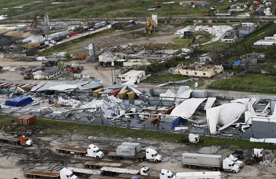 An aerial photo shows a damaged factory following the devastating Tropical Cyclone Idai in Beira, Mozambique, Saturday, March 23, 2019. A second week has begun with efforts to find and help some t ...