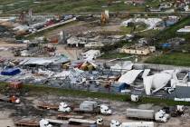 An aerial photo shows a damaged factory following the devastating Tropical Cyclone Idai in Beira, Mozambique, Saturday, March 23, 2019. A second week has begun with efforts to find and help some t ...