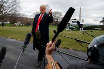 President Donald Trump talks with reporters before boarding Marine One on the South Lawn of the White House, Friday, March 22, 2019, in Washington. (AP Photo/Evan Vucci)