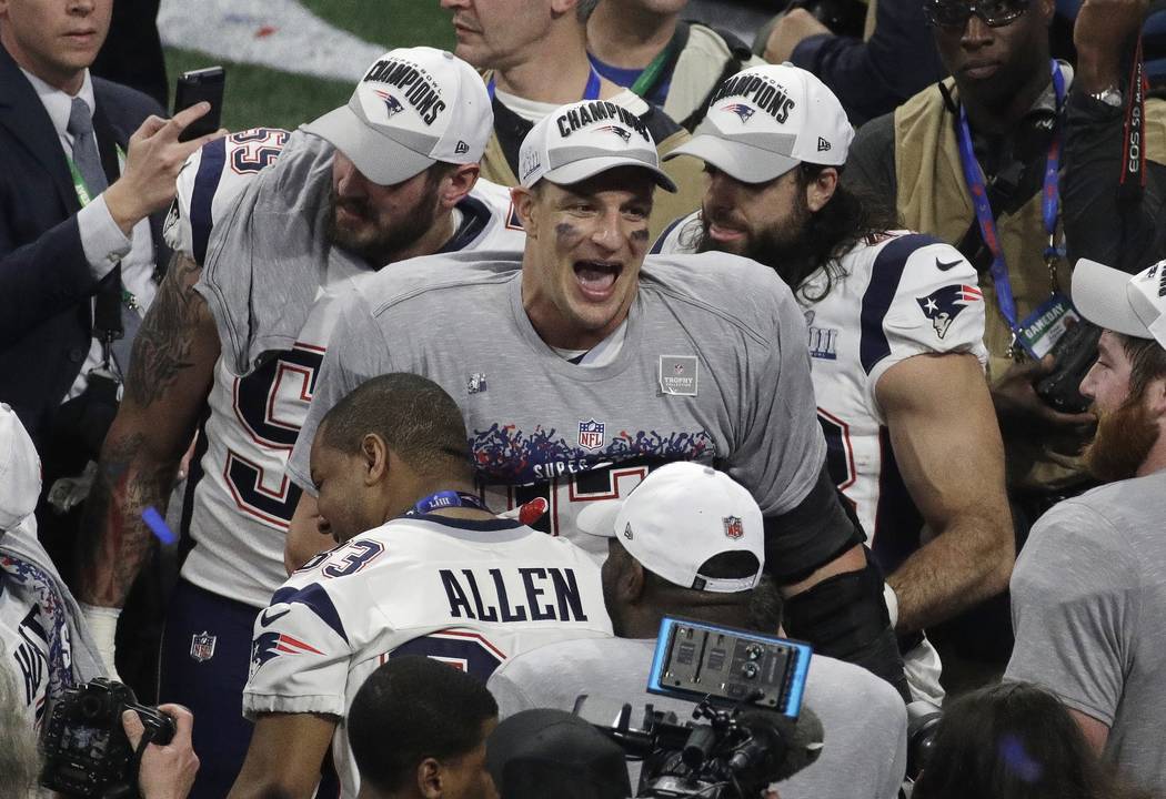 New England Patriots' Rob Gronkowski (87) celebrates with teammates after the NFL Super Bowl 53 football game against the Los Angeles Rams, Sunday, Feb. 3, 2019, in Atlanta. The Patriots won 13-3. ...