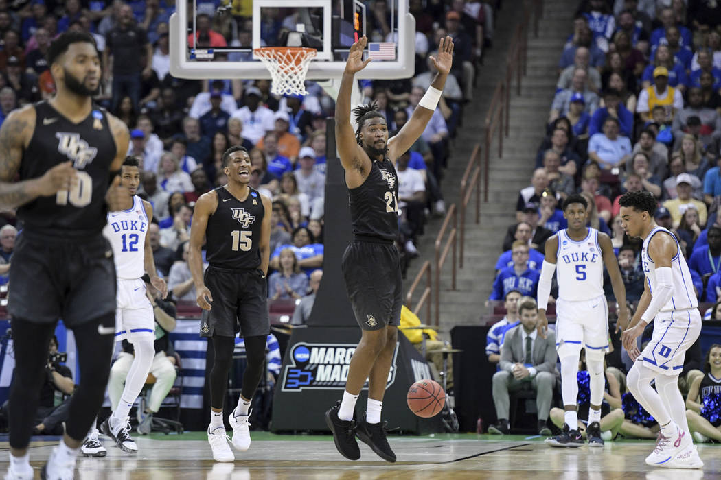 Central Florida forward Chad Brown (21) celebrates after a dunk against Duke during the first half of a second-round game in the NCAA men's college basketball tournament Sunday, March 24, 2019, in ...