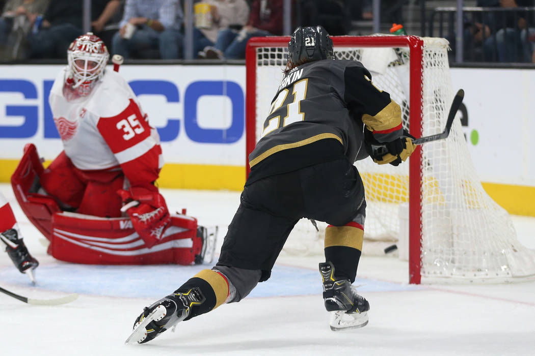 Vegas Golden Knights center Cody Eakin (21) shoots for a score against the Detroit Red Wings during the second period of an NHL hockey game at T-Mobile Arena in Las Vegas, Saturday, March 23, 2019 ...