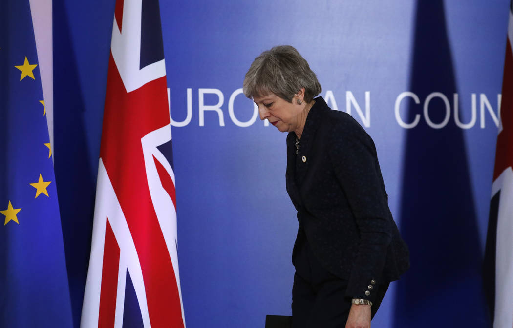 British Prime Minister Theresa May leaves after addressing a media conference at an EU summit in Brussels, Friday, March 22, 2019. Worn down by three years of indecision in London, EU leaders on T ...