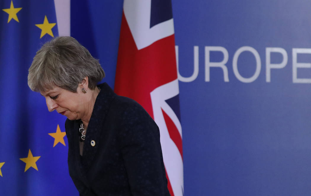 British Prime Minister Theresa May leaves after addressing a media conference at an EU summit in Brussels, Friday, March 22, 2019. Worn down by three years of indecision in London, EU leaders on T ...