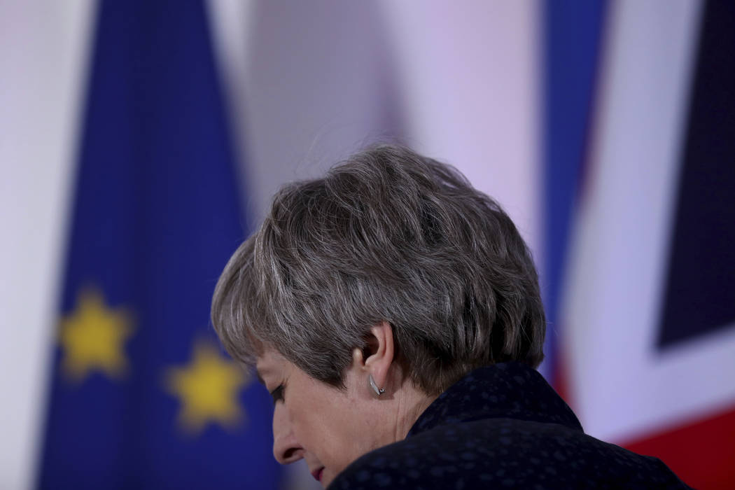 British Prime Minister Theresa May leaves after addressing a media conference at an EU summit in Brussels, Friday, March 22, 2019. Worn down by three years of indecision in London, EU leaders on T ...