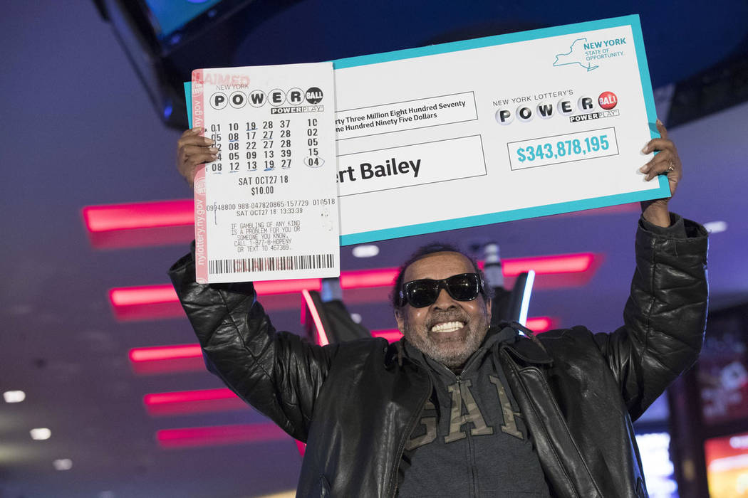 Robert Bailey poses for photographers during a news conference at the Resorts World Casino New York City, Wednesday, Nov. 14, 2018, in New York. The retired government worker won over $343 million ...