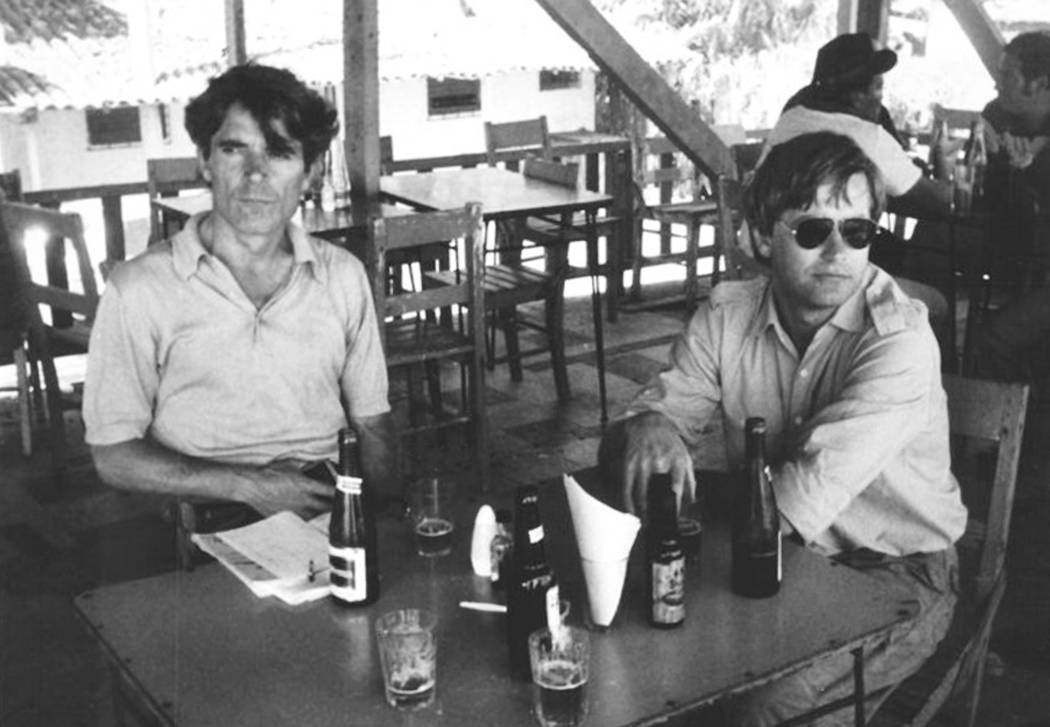 In this undated photo provided by Gert Kuiper, his brother, Jan Kuiper, right, sits with fellow journalist Koos Koster, two of the four journalists killed in El Salvador in 1982. Calls are mountin ...