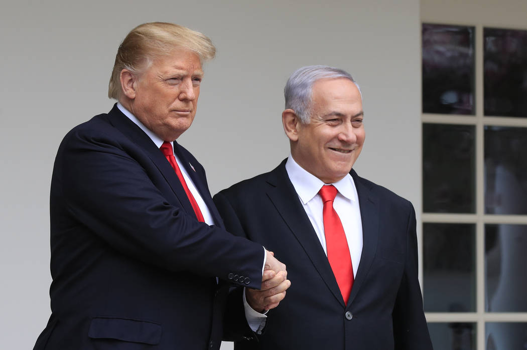 President Donald Trump welcomes visiting Israeli Prime Minister Benjamin Netanyahu to the White House in Washington, Monday, March 25, 2019. (AP Photo/Manuel Balce Ceneta)