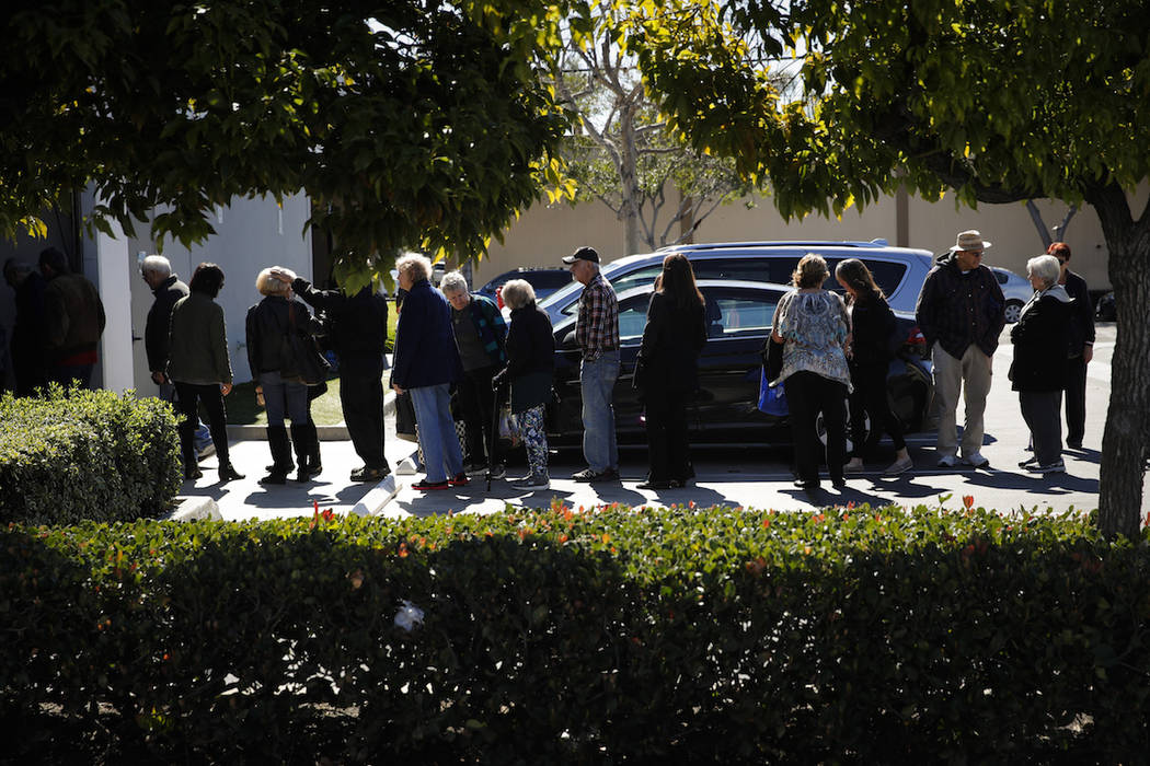 In this Feb. 19, 2019 photo, a group of retired seniors from Laguna Woods Village form a line outside Bud and Bloom cannabis dispensary to attend a presentation organized by cannabis product vendo ...