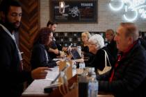 In this Feb. 19, 2019 photo, a group of seniors from Laguna Woods Village consult with sales associates at Bud and Bloom cannabis dispensary in Santa Ana, Calif. The seniors boarded a bus for the ...