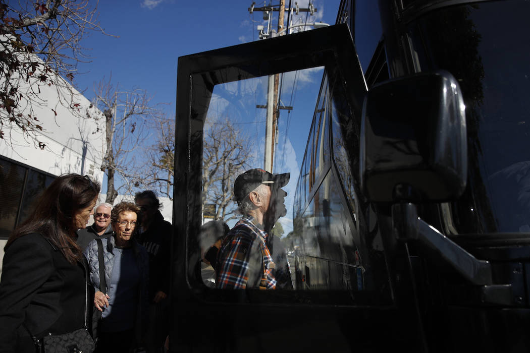 In this Feb. 19, 2019 photo, a group of seniors from Laguna Woods Village board a free shuttle bus back to their retirement community after visiting Bud and Bloom cannabis dispensary in Santa Ana, ...