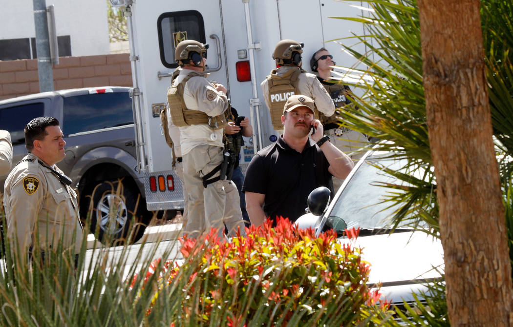 Metropolitan Police Department SWAT units are visible during a barricade situation near Grand Teton and Durango in the northwest area of the Las Vegas valley, Saturday, March 23, 2019. (Chitose Su ...
