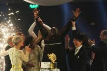 Kenyan teacher Peter Tabichi, center, reacts after winning the $1 million Global Teacher Prize in Dubai, United Arab Emirates, Sunday, March 24, 2019. Tabichi is a science teacher who gives away 8 ...