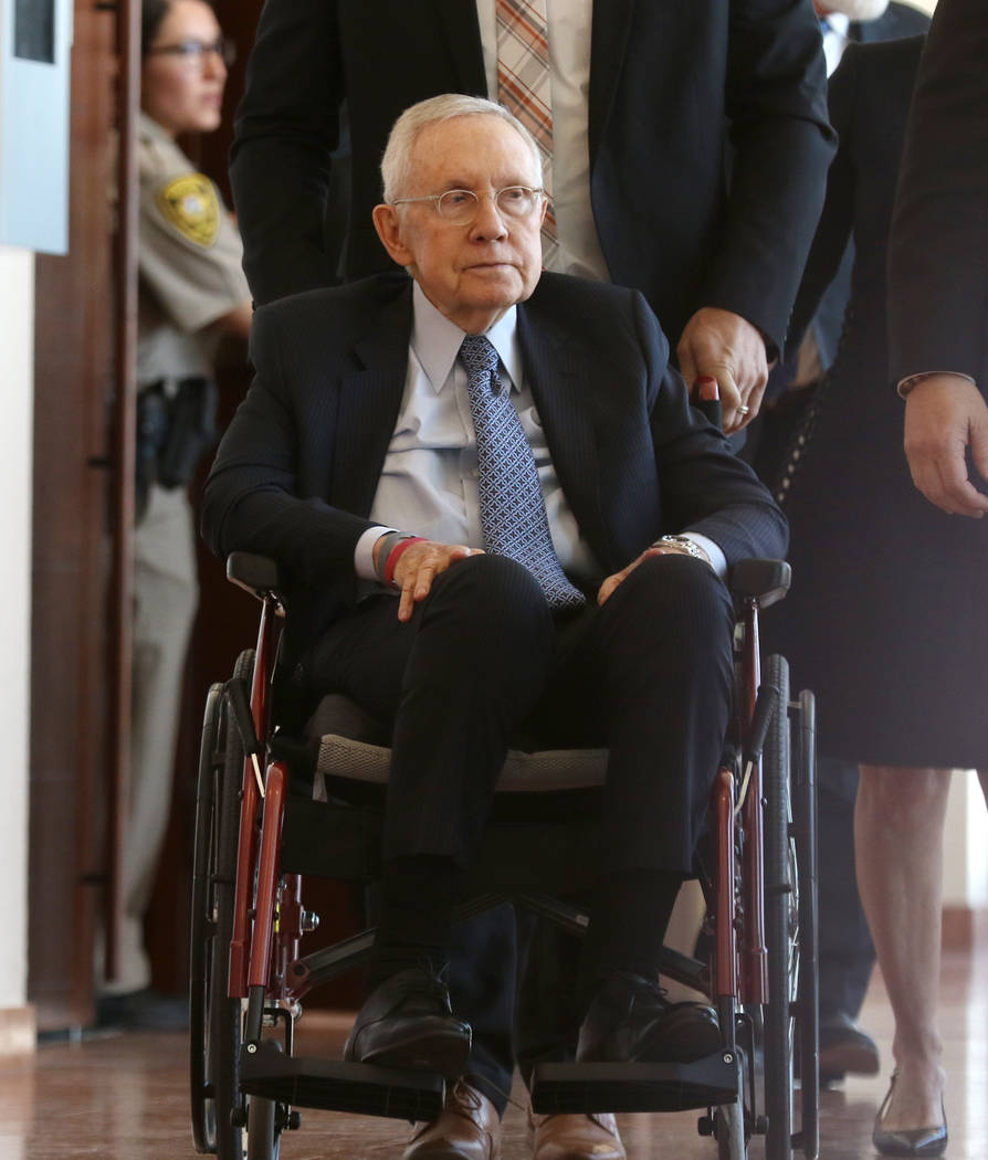 Former U.S. Sen. Harry Reid, who sued the makers of an exercise band after injuring his eye, leaves the courtroom after attending the first day of jury selection in his civil trial at the Regional ...