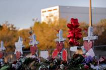 A makeshift memorial is seen Feb. 19, 2018, outside the Marjory Stoneman Douglas High School, where 17 students and faculty were killed in a mass shooting in Parkland, Fla. (AP Photo/Gerald Herber ...