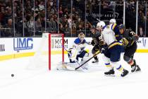Vegas Golden Knights right wing Ryan Reaves (75) skates toward St. Louis Blues center Tyler Bozak (21) as he goes after the puck during the first period of their NHL game in Las Vegas, Friday, Nov ...