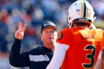 North head coach Jon Gruden, of the Oakland Raiders, talks with North quarterback Drew Lock, of Missouri, during the first half of the Senior Bowl college football game, Saturday, Jan. 26, 2019, i ...