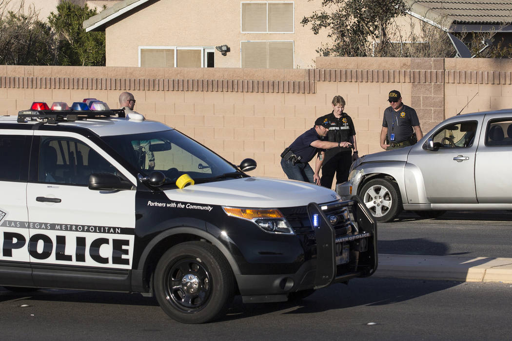 Law enforcement investigate a car accident at South Fort Apache Road and West Arby Avenue that left one minor dead and one hospitalized on Monday, March 25, 2019, in Las Vegas. (Benjamin Hager Rev ...