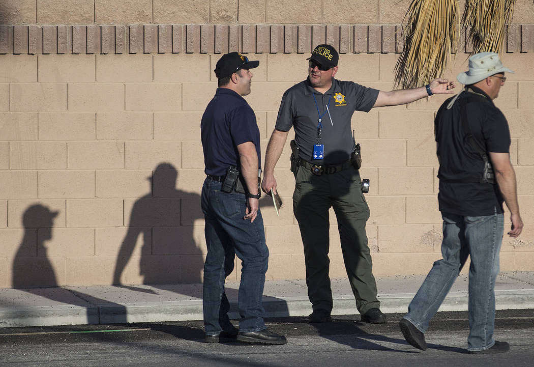 Law enforcement investigate a car accident at South Fort Apache Road and West Arby Avenue that left one minor dead and one hospitalized on Monday, March 25, 2019, in Las Vegas. (Benjamin Hager Rev ...