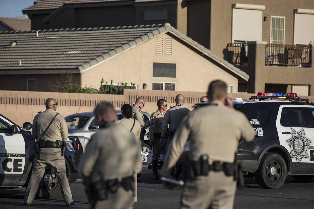 Law enforcement investigate a car accident at South Fort Apache Road and West Arby Avenue that left one minor dead and one hospitalized on Monday, March 25, 2019, in Las Vegas. (Benjamin Hager Rev ...