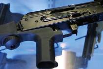 This Oct. 4, 2017 file photo, shows a "bump stock" attached to a semi-automatic rifle at a gun store and shooting range in Utah. (Rick Bowmer/AP File)