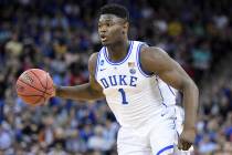 Duke forward Zion Williamson (1) dribbles the ball during the first half of a second-round game in the NCAA men's college basketball tournament Sunday, March 24, 2019, in Columbia, S.C. Duke defea ...