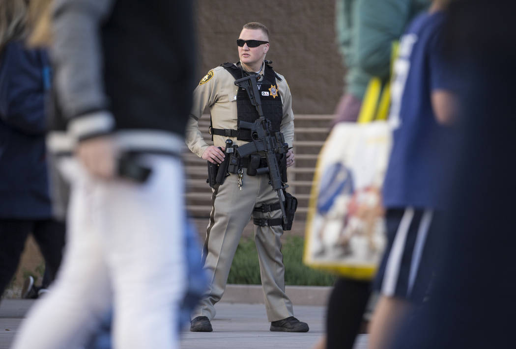 Metro officer Dallin Van Buskirk, armed with an AR-15 semi-automatic rifle with a scope, patrol ...